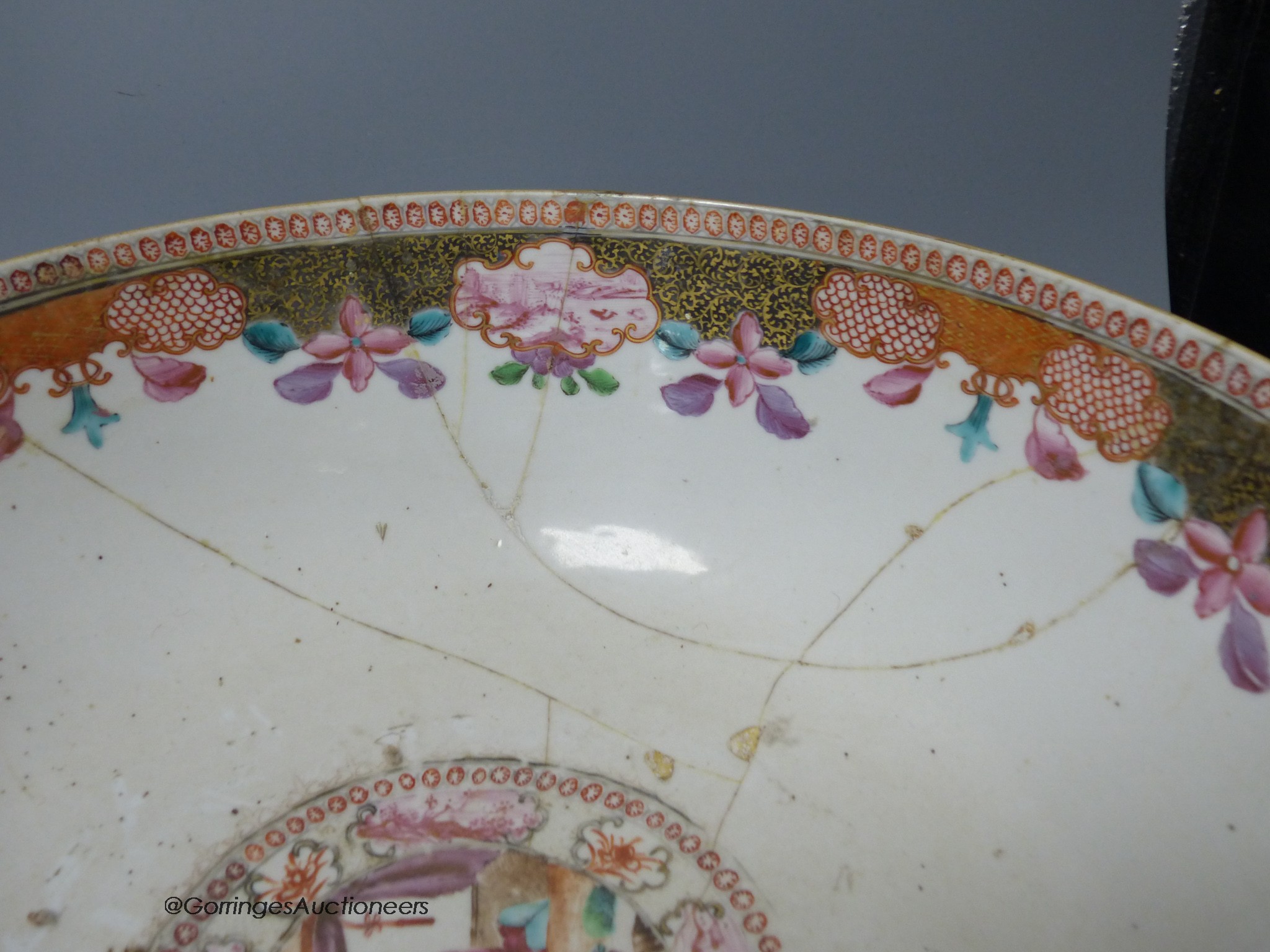 An 18th century Chinese Export famille rose punch bowl and another similar bowl (a.f.), largest 32cm diameter